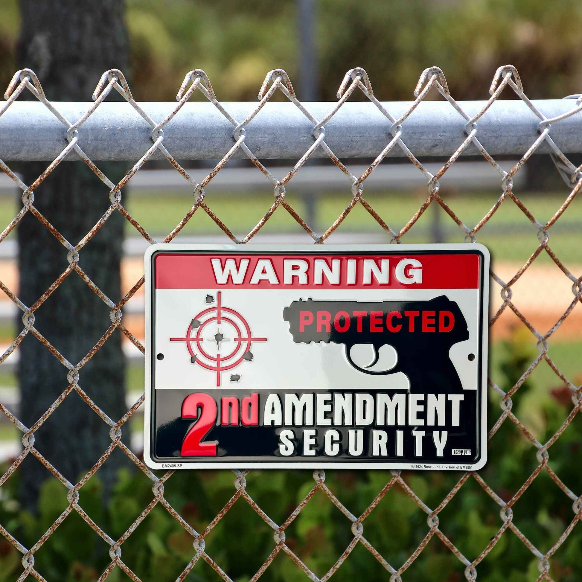 Warning Protected 2 Amendment Security on the fence