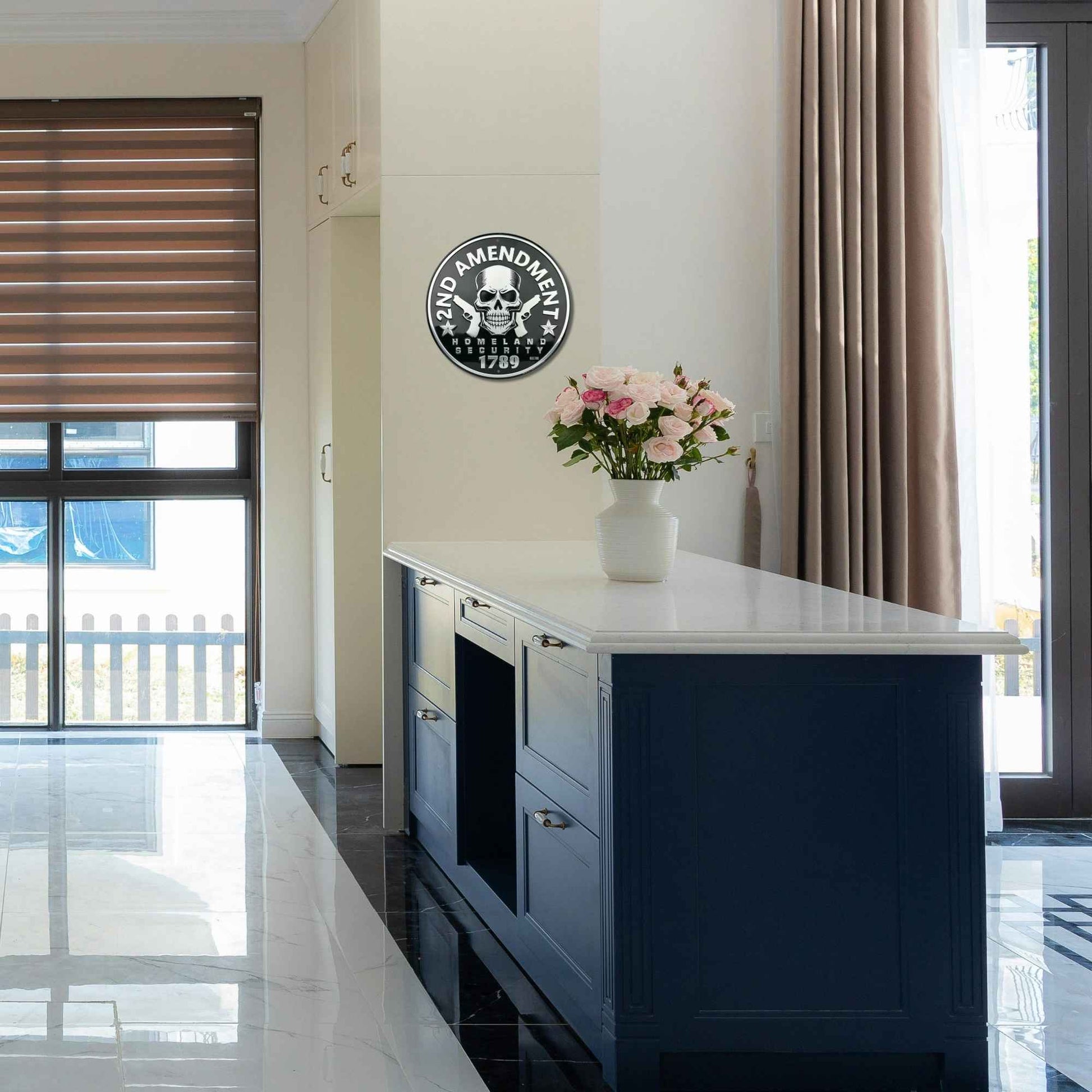 Modern kitchen with a blue island and decorative wall clock.