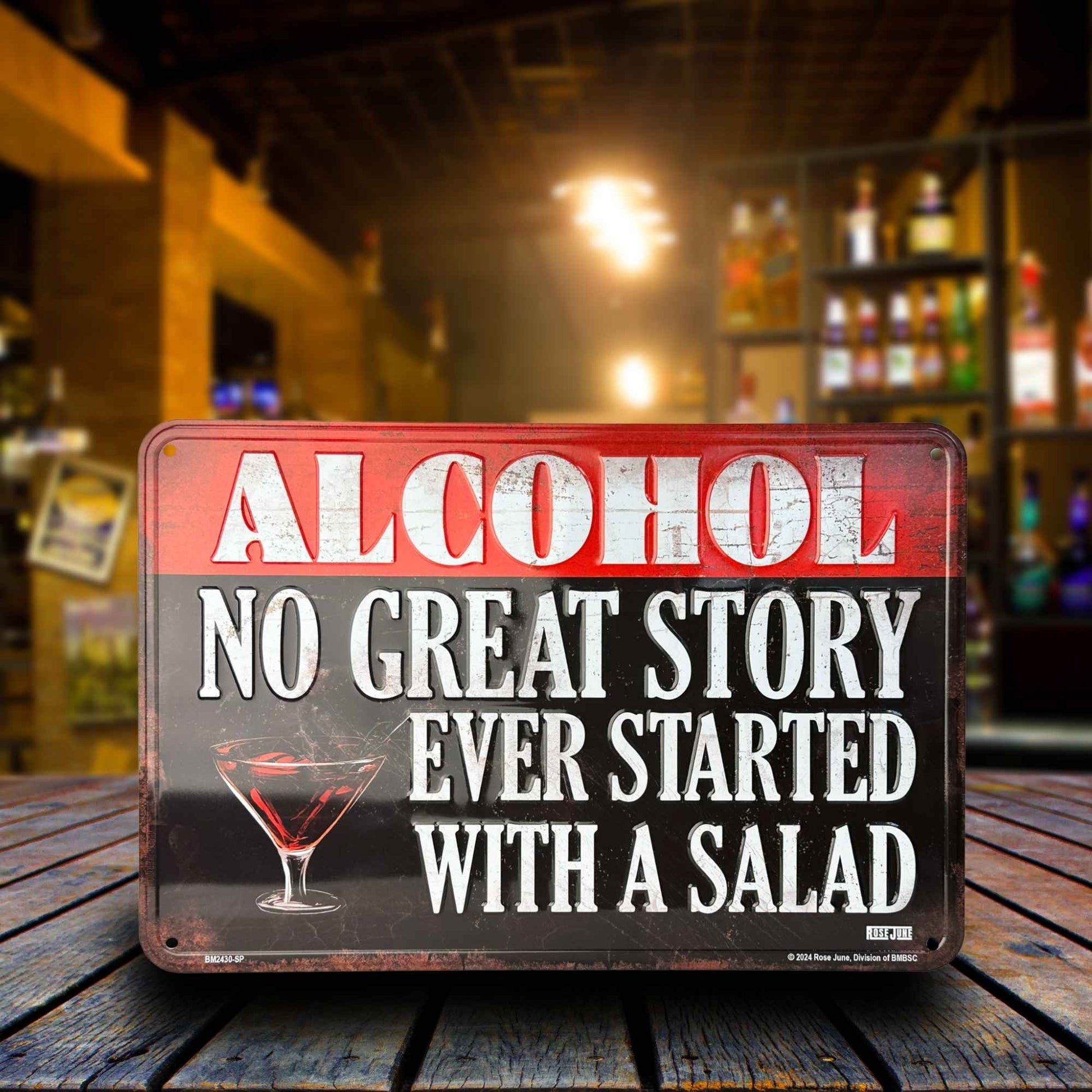 Metal sign with humorous alcohol quote on a bar counter