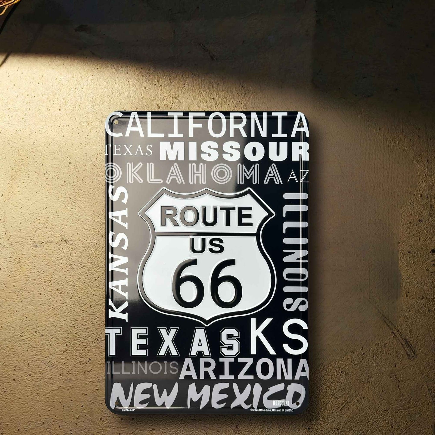 Decorative sign with Route 66 design on a textured surface